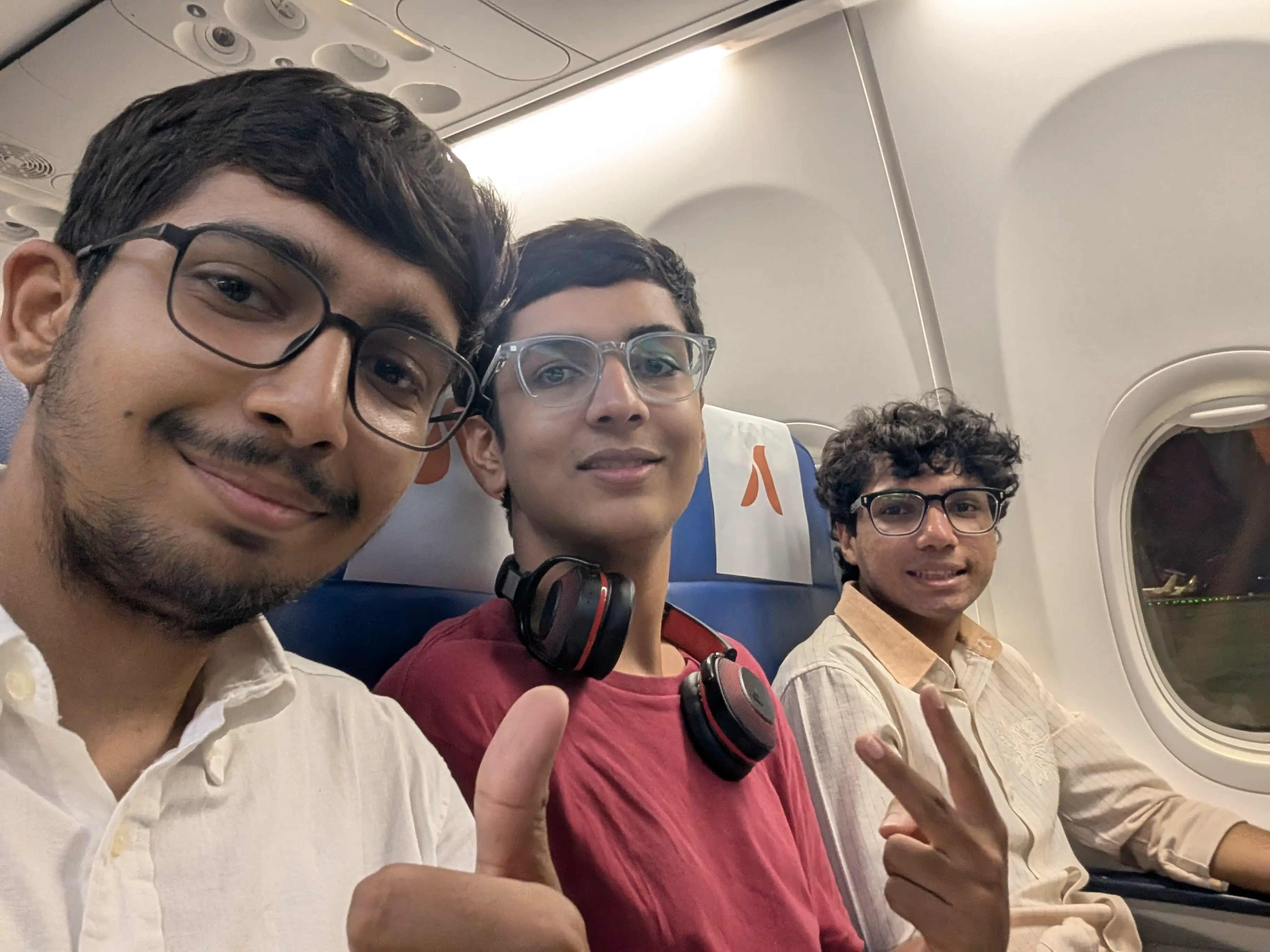 Three engineers on the flight back after the Army base mission
